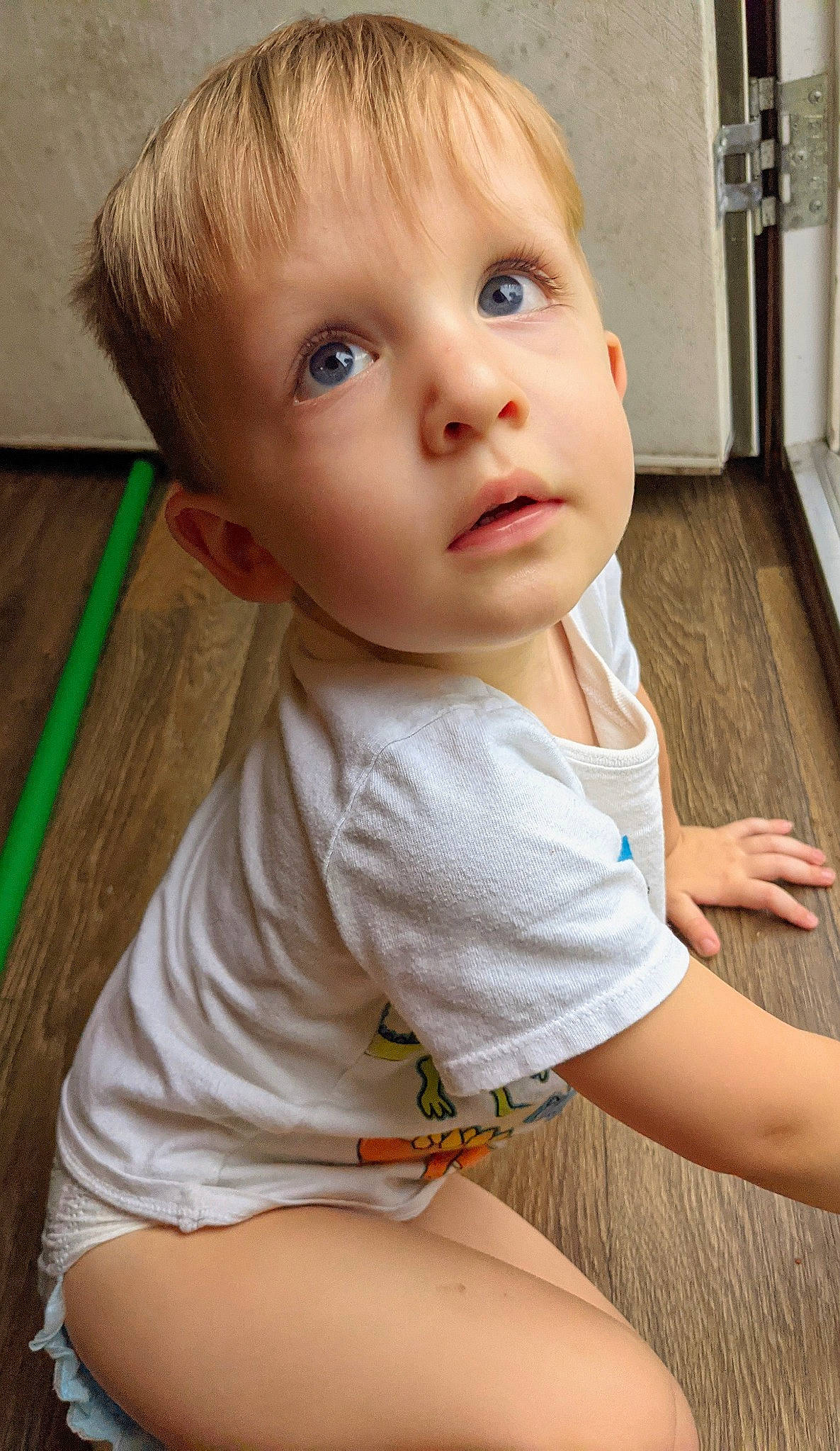 Gus is registered to the contest to win money with this photo: baby, baby_toddler_clothing, cheek, child, chin, eyelash, iris, joint, leg, lip, mouth, neck, nose, organ, person, skin, sleeve, standing, t_shirt, toddler
