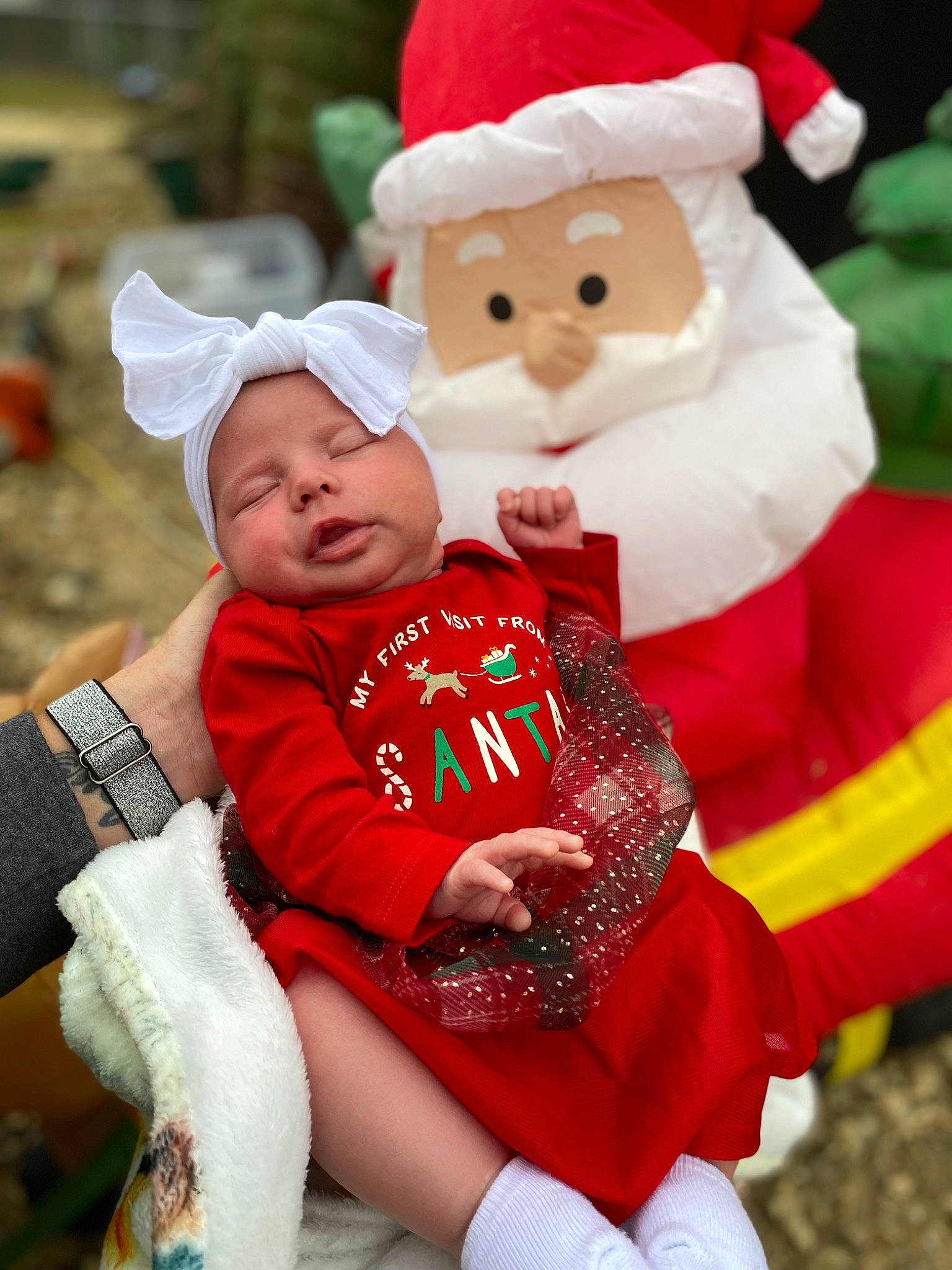 Hadleigh is registered to the contest to win money with this photo: baby, carmine, child, christmas, christmas_eve, christmas_ornament, costume_hat, event, fictional_character, fun, fur, happy, hat, headwear, holiday, lap, person, red, santa_claus, toddler