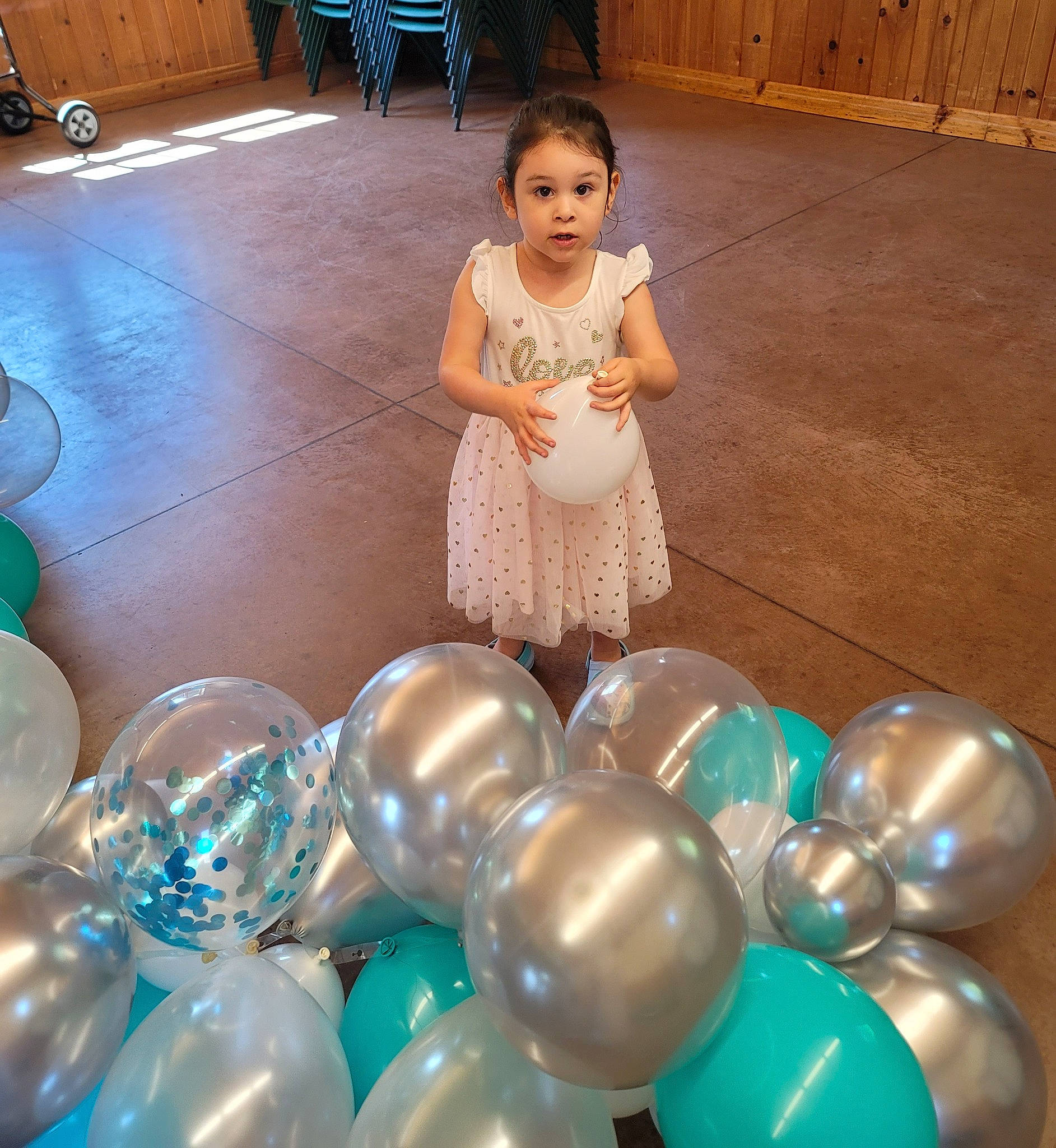 Izabella is registered to the contest to win money with this photo: ball, balloon, beauty, child, electric_blue, event, flooring, fun, glass, happy, leisure, lighting, organ, party, party_supply, person, play, recreation, sitting, snapshot