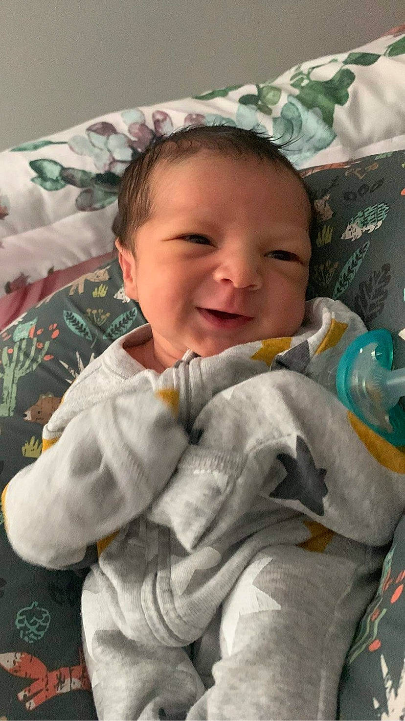 Jameson is registered to the contest to win money with this photo: baby, baby_products, baby_sleeping, baby_toddler_clothing, bedding, bedtime, blanket, cheek, child, comfort, happy, joy, linens, person, room, sitting, skin, sleep, sleeve, smile