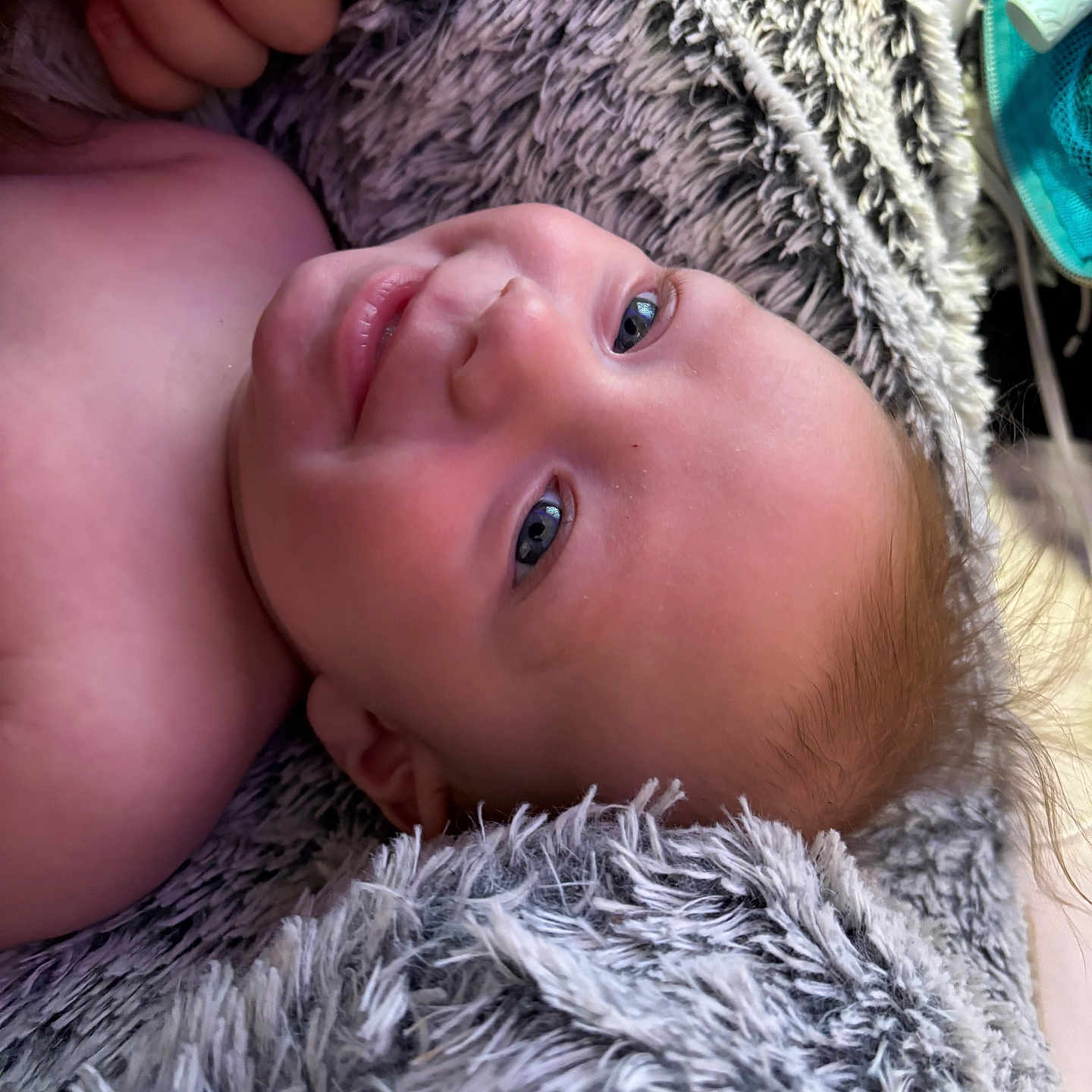 Jordan joined the competition — help win amazing prizes! baby, blanket, blue_eyes, child, closeup, cozy, cute, face, fluffy, hand, happy, infant, lying_down, nails, painted_nails, portrait, skin, smiling, soft, texture
