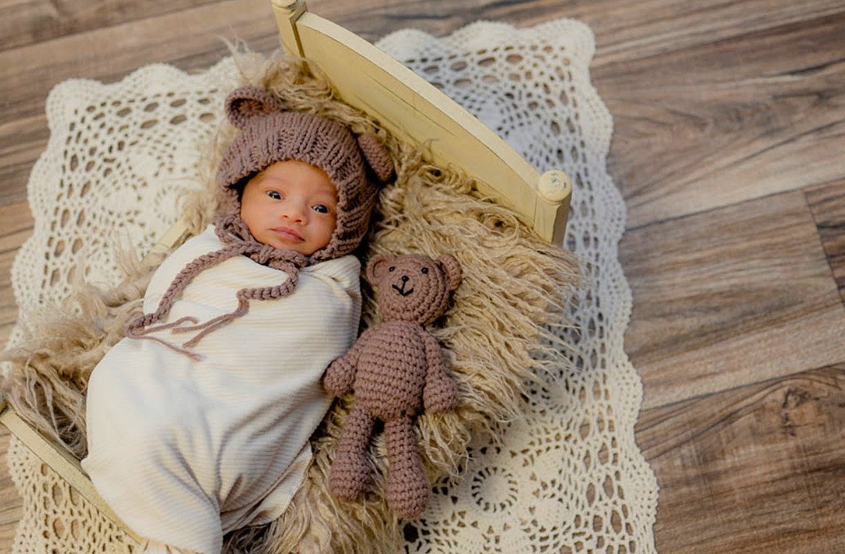 Brooklyn is registered to the contest to win money with this photo: baby, baby_sleeping, basket, bedding, comfort, doll, eye, fashion_accessory, fawn, fur, hardwood, headwear, linens, pattern, person, skin, stuffed_toy, thread, toy, wood