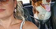Brownie a rejoint le concours — aidez-le/la à gagner de superbes lots ! woman, dog, car, seatbelt, sunglasses, white_top, dog_harness, pet, backseat, portrait, smile, happy, interior, travel, road_trip, sunlight, leisure, safety, canine, passenger