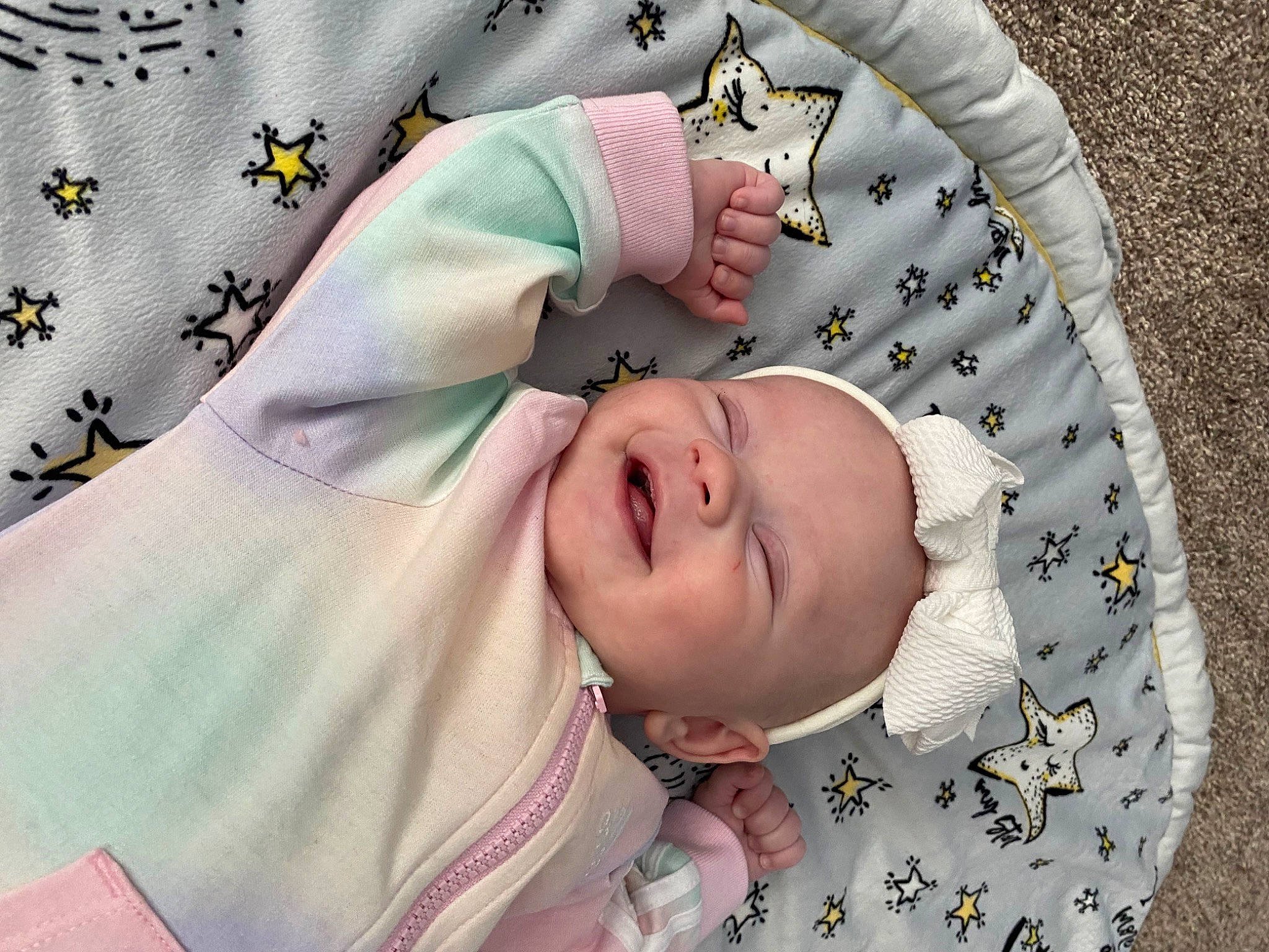 Kaylani is registered to the contest to win money with this photo: baby, baby_laughing, baby_products, baby_safety, baby_sleeping, baby_toddler_clothing, child, comfort, fashion_accessory, happy, linens, pattern, person, pink, skin, sleeve, smile, textile, toddler, white
