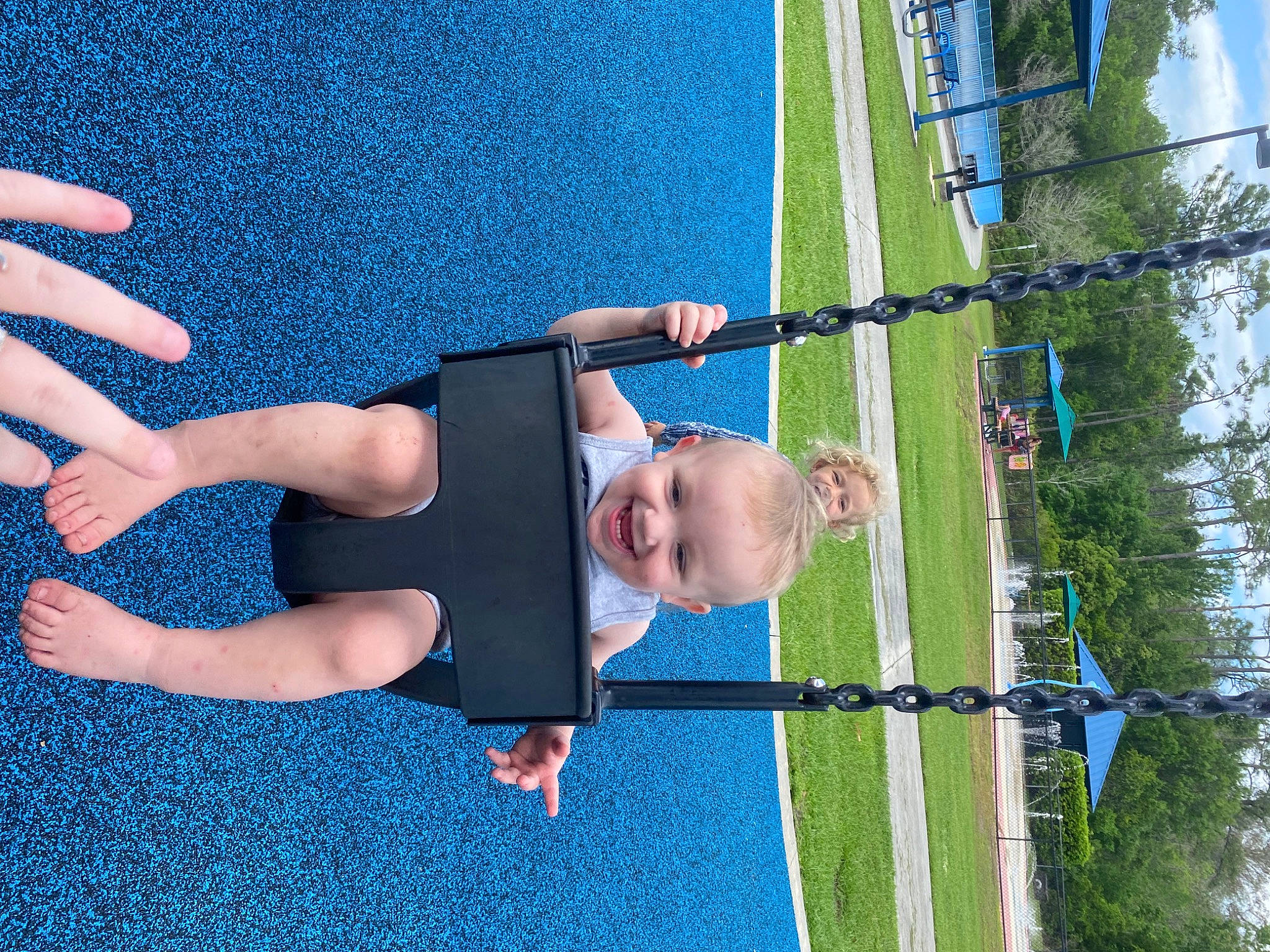 Bryson joined the competition — help win amazing prizes! baby, blue, daytime, fun, gesture, grass, happy, human_body, joy, leg, leisure, line, people_in_nature, person, playground, recreation, sky, smile, summer, toddler