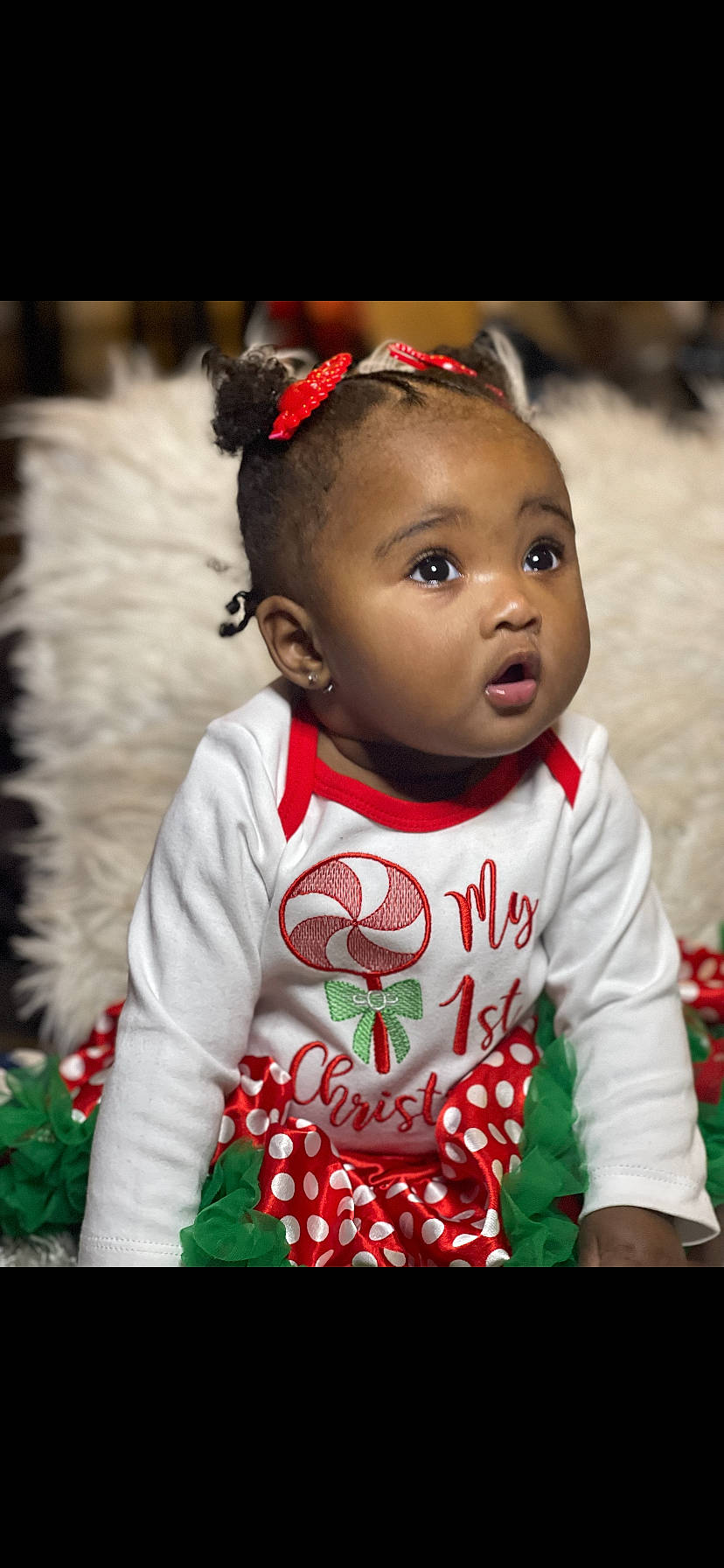 Anyla is registered to the contest to win money with this photo: baby, baby_toddler_clothing, cheek, child, chin, clothing, dress, face, facial_expression, grass, hair, happy, head, leaf, lip, person, red, skin, sleeve, surprise