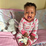 Zaylah joined the competition — help win amazing prizes! baby, babylaughing, bed, bedroom, clothing, couch, crib, cushion, face, furniture, happy, head, homedecor, indoors, infantbed, pajamas, person, photography, portrait, room