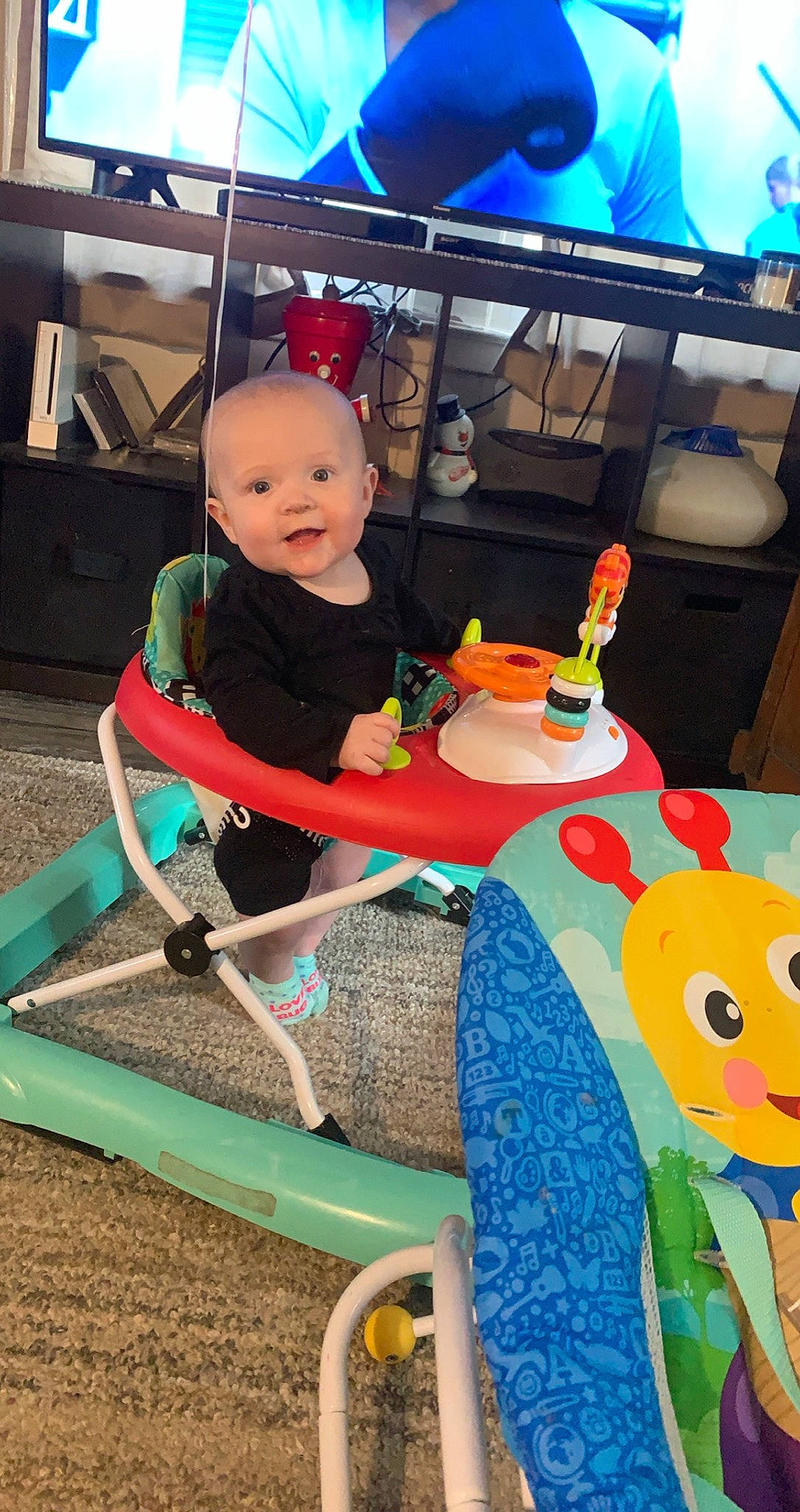 Paisley Marie joined the competition — help win amazing prizes! baby, baby_toddler_clothing, blue, chair, child, city, fun, leisure, person, play, public_space, recreation, riding_toy, shorts, sitting, smile, summer, t_shirt, toddler, toy