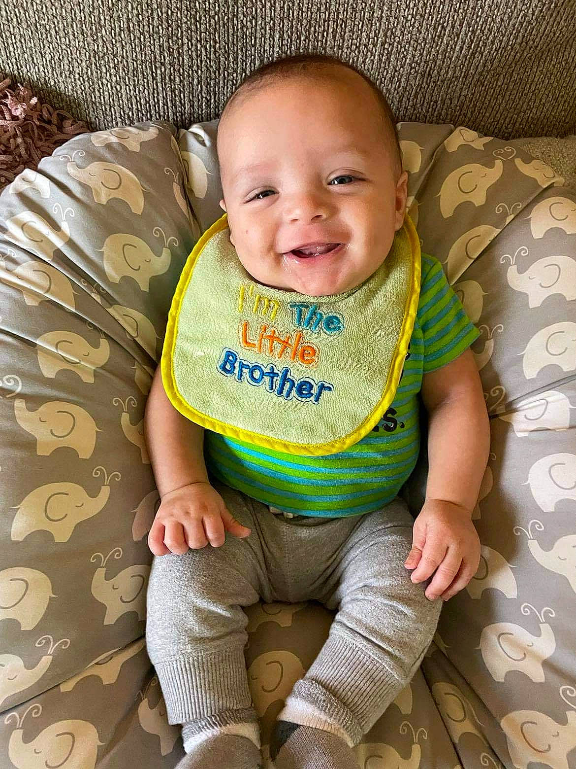 Alakai is registered to the contest to win money with this photo: baby, baby_toddler_clothing, cheek, comfort, eye, face, facial_expression, finger, happy, head, human_body, iris, joy, nose, outerwear, person, product, skin, sleeve, smile