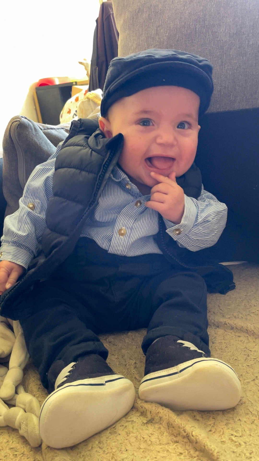 Klayton participe au concours pour gagner de l'argent avec cette photo : baby, child, smiling, sitting, clothing, hat, vest, shoes, indoor, blanket, cute, portrait, happy, infant, person, footwear, young_child, casual, cozy, playful