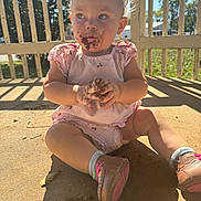 Hadley joined the competition — help win amazing prizes! toddler, child, dirt, face, hands, shoes, pink_clothing, sunlight, porch, outdoor, shadow, headband, expression, sitting, concrete_floor, nature, daylight, casual, playful, messy