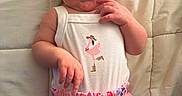 Octavia joined the competition — help win amazing prizes! baby, bed, blanket, blue, clothing, cute, flamingo, flower, infant, patterned_clothing, person, pink, portrait, quilt, rainbow, red, shorts, smile, strawberry, tank_top