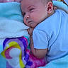 Octavia joined the competition — help win amazing prizes! baby, infant, blanket, soft_texture, pastel_colors, sleeping, resting, cozy, child, cute, face, skin, clothing, blue_shirt, indoor, comfort, peaceful, young, head, portrait