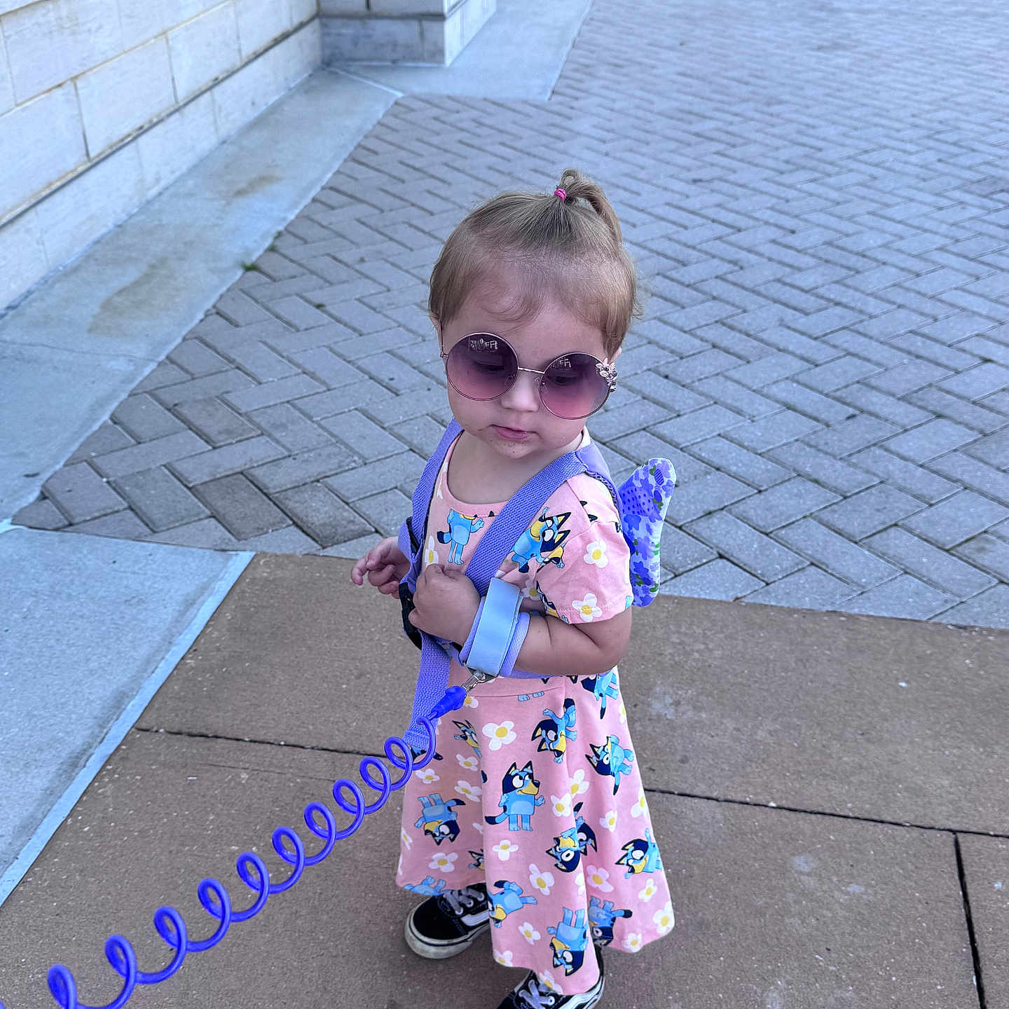 Emiko is registered to the contest to win money with this photo: accessories, child, clothing, dress, face, female, flagstone, footwear, formalwear, girl, head, path, person, photography, portrait, shoe, sidewalk, strap, sunglasses, walkway