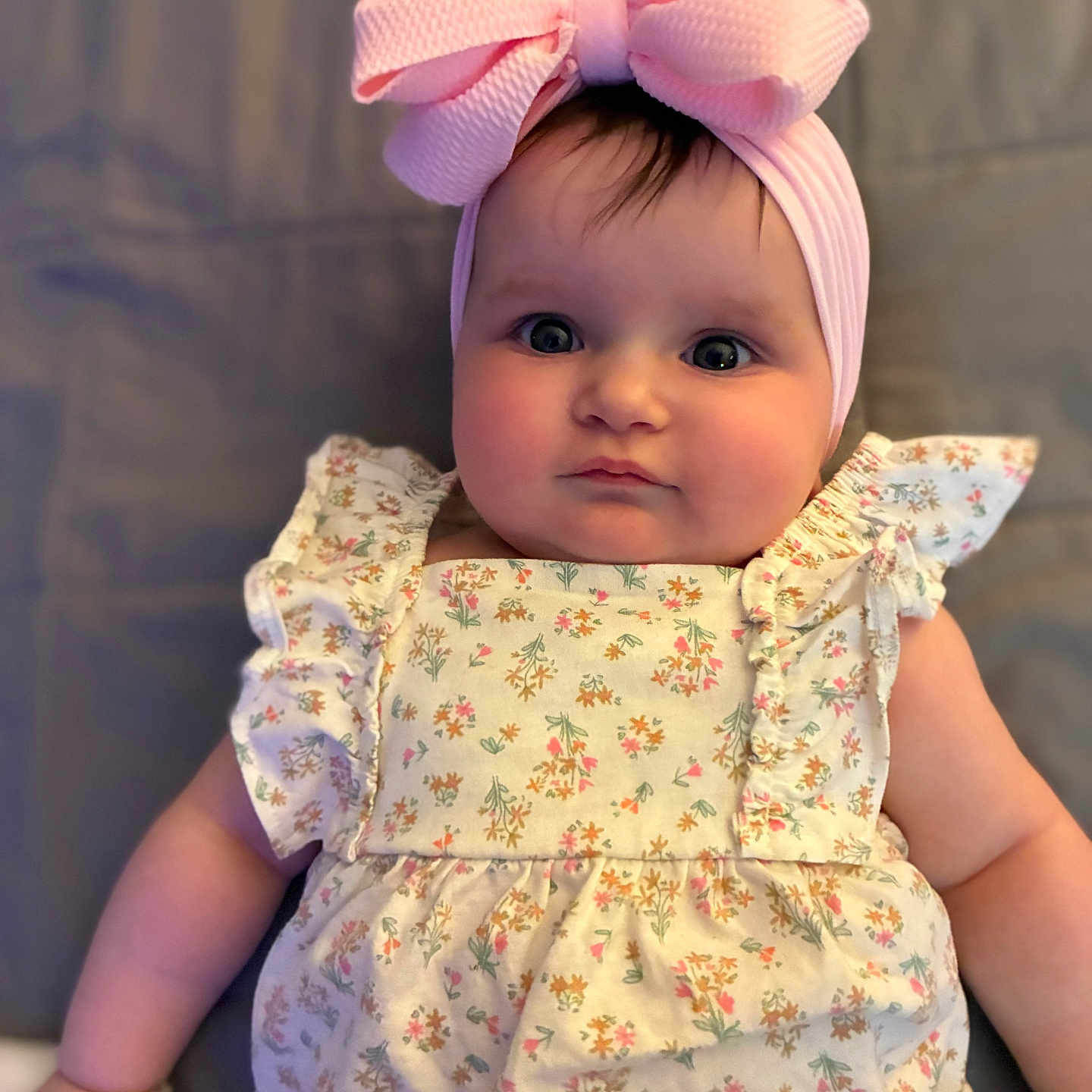 Espyn joined the competition — help win amazing prizes! adorable, baby, baby_fashion, child, chubby_cheeks, closeup, cute, face, fashion, floral_dress, headband, indoor, infant, laying_down, person, pink_bow, portrait, smile, soft_lighting, young_child