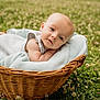 baby, basket, blanket, outdoor, grass, clover, flowers, infant, cute, portrait, nature, child, resting, soft, cozy, wicker, greenery, curious, summer, peaceful