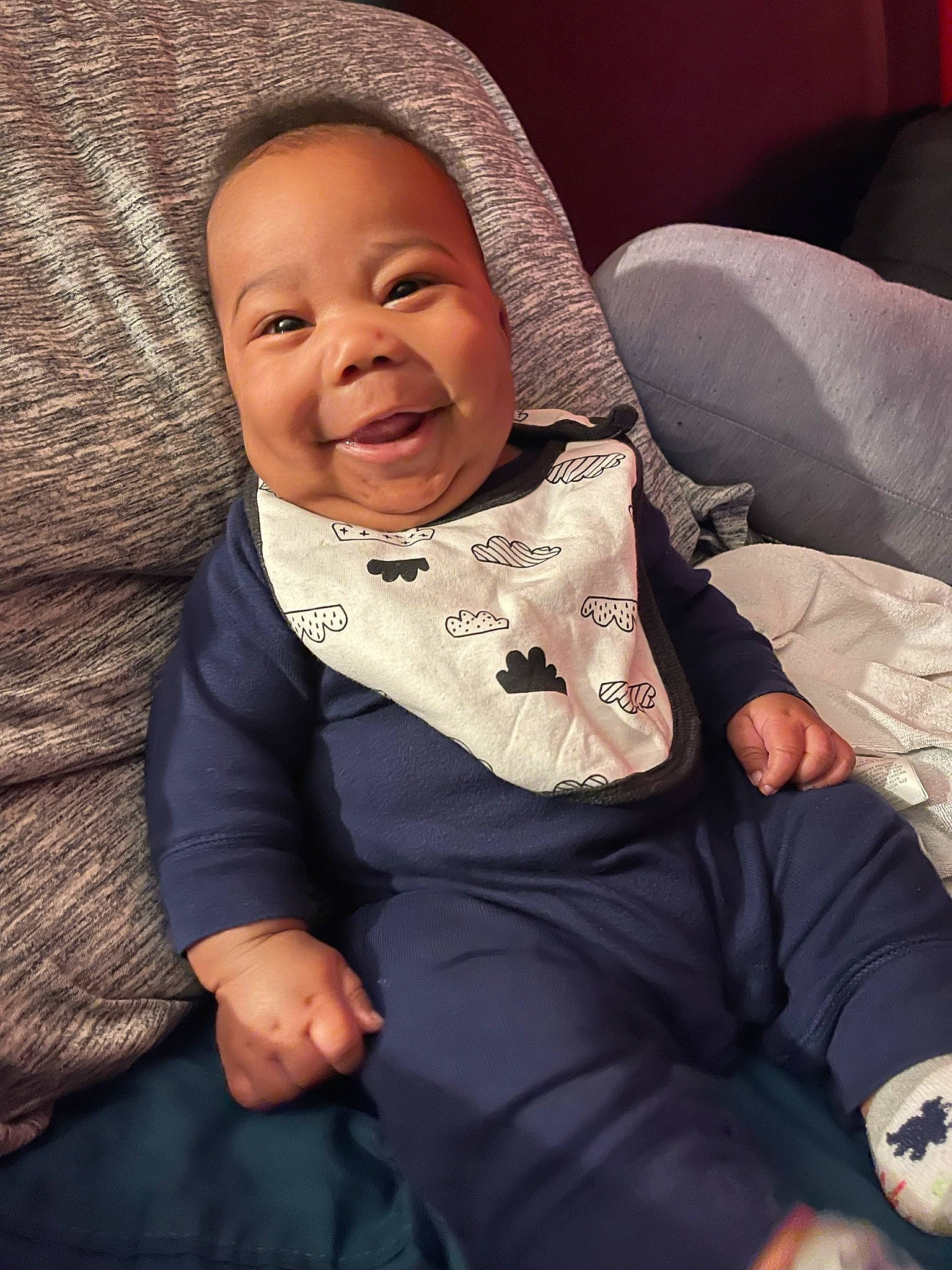 Denzel is registered to the contest to win money with this photo: baby, baby_toddler_clothing, cheek, chin, comfort, cool, eye, finger, flash_photography, happy, head, human_body, jacket, joy, lip, mouth, nose, person, skin, sleeve