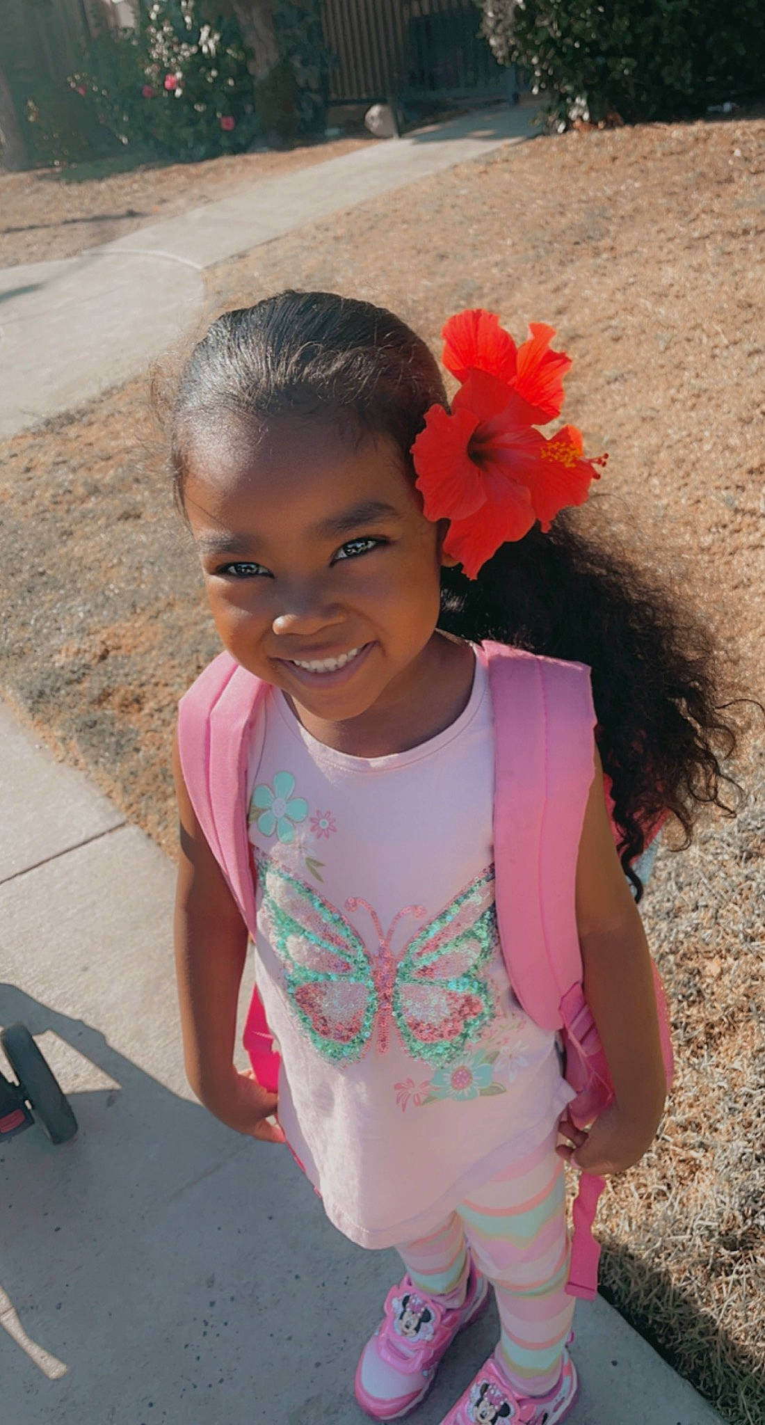 Lareina is registered to the contest to win money with this photo: adaptation, child, facial_expression, fashion_accessory, fun, grass, hairstyle, happy, human, joy, leisure, lip, magenta, mammal, person, petal, pink, skin, smile, toddler