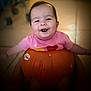 baby, babylaughing, bodypart, clothing, face, finger, food, happy, head, laughing, person, photography, plant, portrait, produce, pumpkin, smile, squash, t_shirt, vegetable