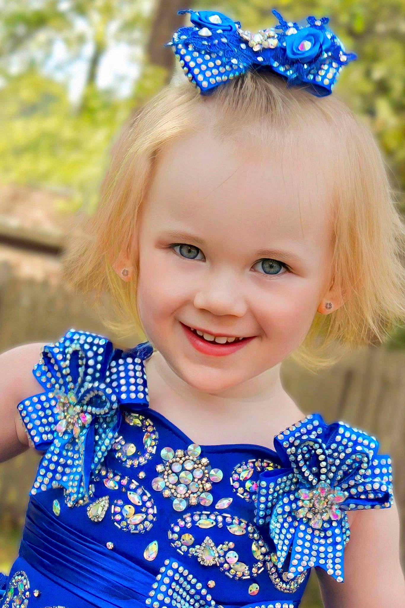 Anilyn is registered to the contest to win money with this photo: azure, baby_toddler_clothing, blue, child, electric_blue, eye, fashion, green, happy, iris, joy, people, person, photograph, pink, plant, purple, sleeve, smile, summer
