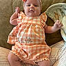 Avery joined the competition — help win amazing prizes! baby, child, infant, couch, blanket, headband, bow, clothing, checkered_pattern, soft_fabric, person, indoor, cute, relaxed, lying_down, arm, legs, socks, face, expression