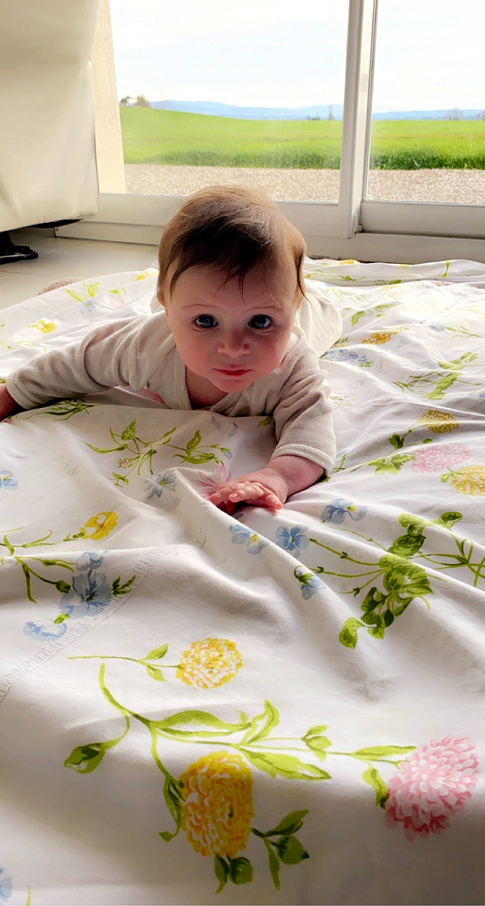 Nolan participe au concours pour gagner de l'argent avec cette photo : baby, baby_toddler_clothing, bed_sheet, bedding, child, comfort, flooring, happy, linens, pattern, person, play, product, room, skin, t_shirt, textile, toddler, white, wood