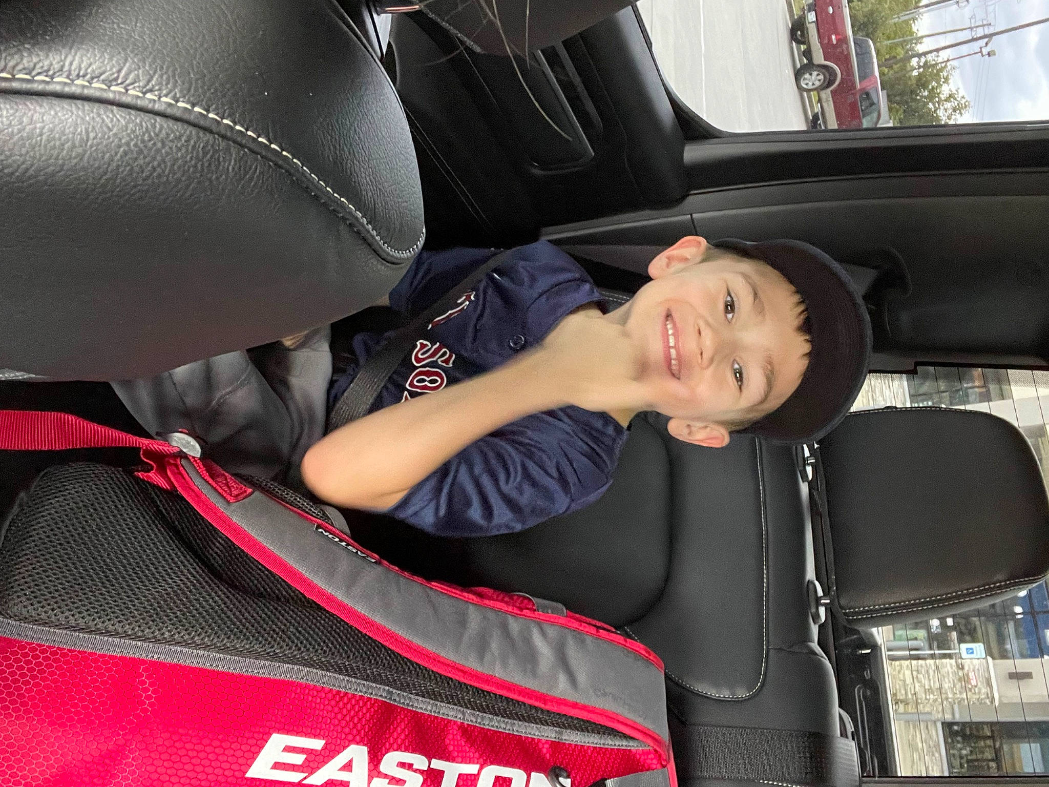 Cayden joined the competition — help win amazing prizes! auto_part, automotive_design, automotive_exterior, automotive_tire, automotive_wheel_system, car, car_seat, car_seat_cover, comfort, hood, joy, mode_of_transport, motor_vehicle, person, personal_luxury_car, plant, smile, steering_wheel, thigh, vehicle