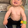 Phillip joined the competition — help win amazing prizes! baby, child, smiling, teddy_bear, carpet, toy, socks, pants, indoor, cute, happy, face, person, sitting, wristband, furniture, living_room, plush, childhood, playtime