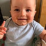 Phillip joined the competition — help win amazing prizes! baby, child, smiling, indoor, baby_seat, toddler, clothing, person, furniture, wood, happy, face, cute, expression, sitting, hand, light, seat, colorful, infant
