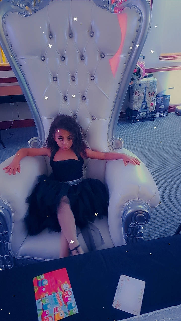 Christyanna is registered to the contest to win money with this photo: aerospace_engineering, air_travel, automotive_design, black_hair, carmine, electric_blue, eyewear, fashion_design, fun, games, human_leg, leisure, magenta, person, pink, purple, recreation, room, sitting, sunglasses