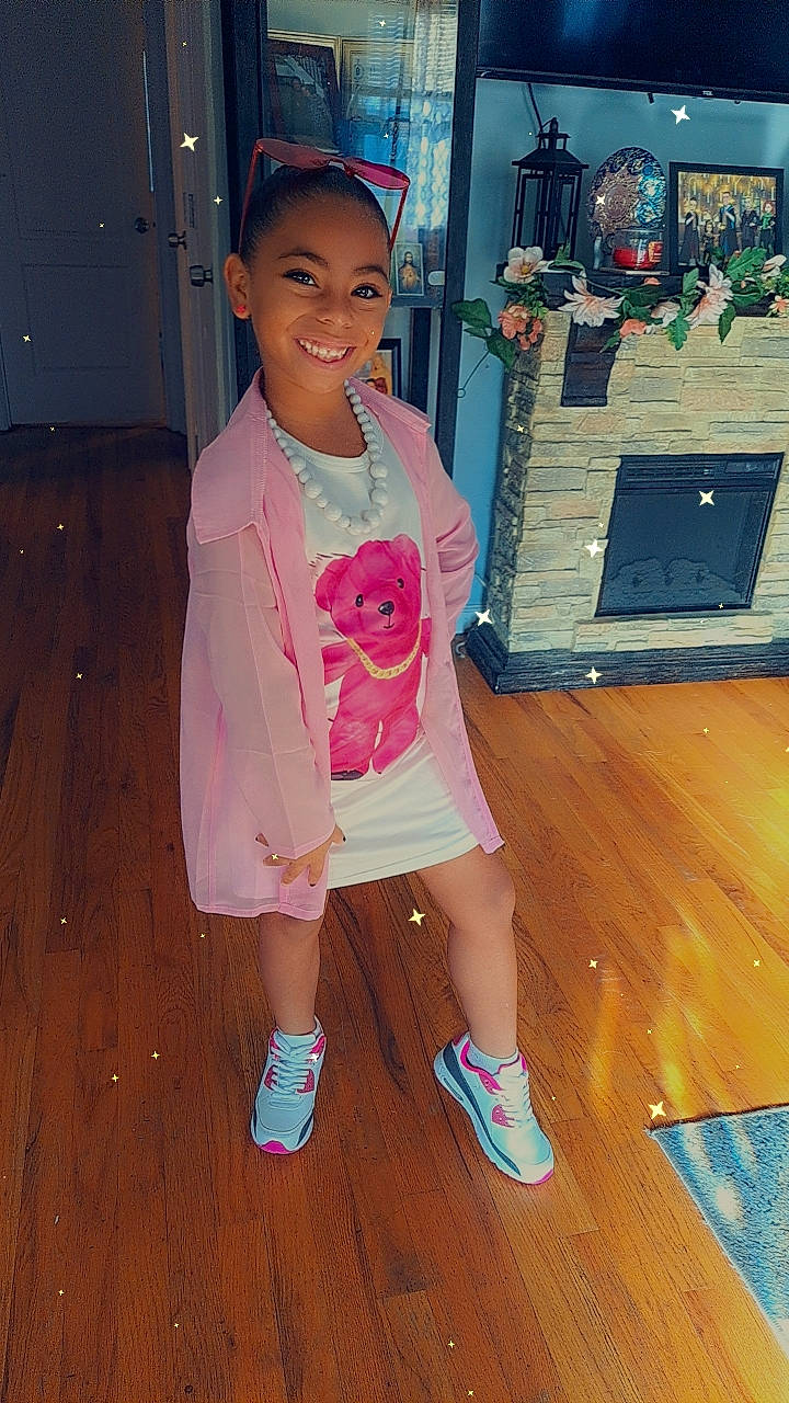 Christyanna joined the competition — help win amazing prizes! baby_toddler_clothing, floor, flooring, fun, happy, hardwood, human_leg, joy, knee, person, shoe, shorts, sleeve, smile, sock, standing, t_shirt, television, thigh, toddler