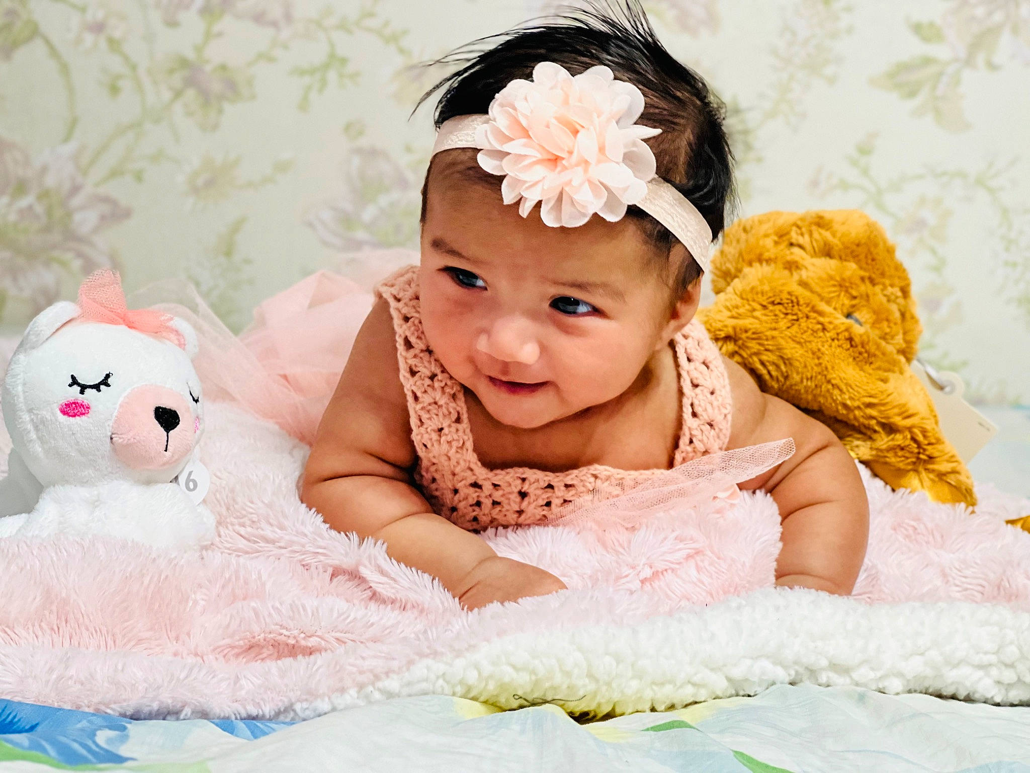 Anaiah joined the competition — help win amazing prizes! baby, baby_sleeping, baby_toddler_clothing, child, embellishment, fashion_accessory, flower, hair_accessory, happy, headband, headpiece, headwear, jewellery, linens, peach, person, petal, pink, skin, smile