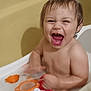 Lucas is registered to the contest to win money with this photo: toddler, child, bath, bathtub, water, foam, toys, happy, laughing, wet_hair, skin, sitting, play, indoor, bath_time, baby, smile, fun, childhood, joy