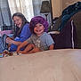 Lucas joined the competition — help win amazing prizes! child, toddler, woman, purple_hat, smile, indoor, couch, blanket, lamp, curtains, window, furniture, happy, person, clothing, living_room, home, seated, family, casual