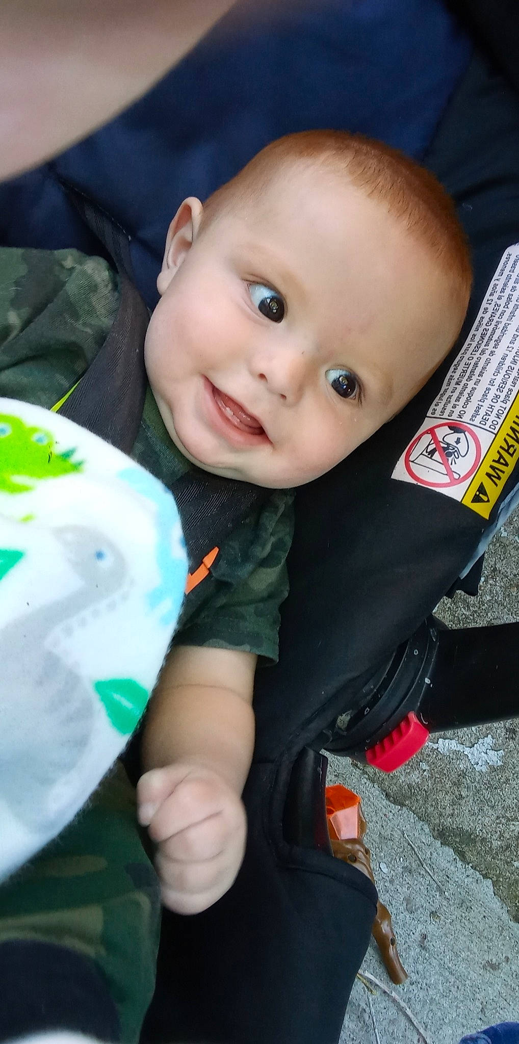 D'Angelo is registered to the contest to win money with this photo: arm, baby, baby_toddler_clothing, cheek, cool, eye, facial_expression, finger, grass, hairstyle, hand, happy, iris, joy, lip, nose, person, skin, sleeve, smile