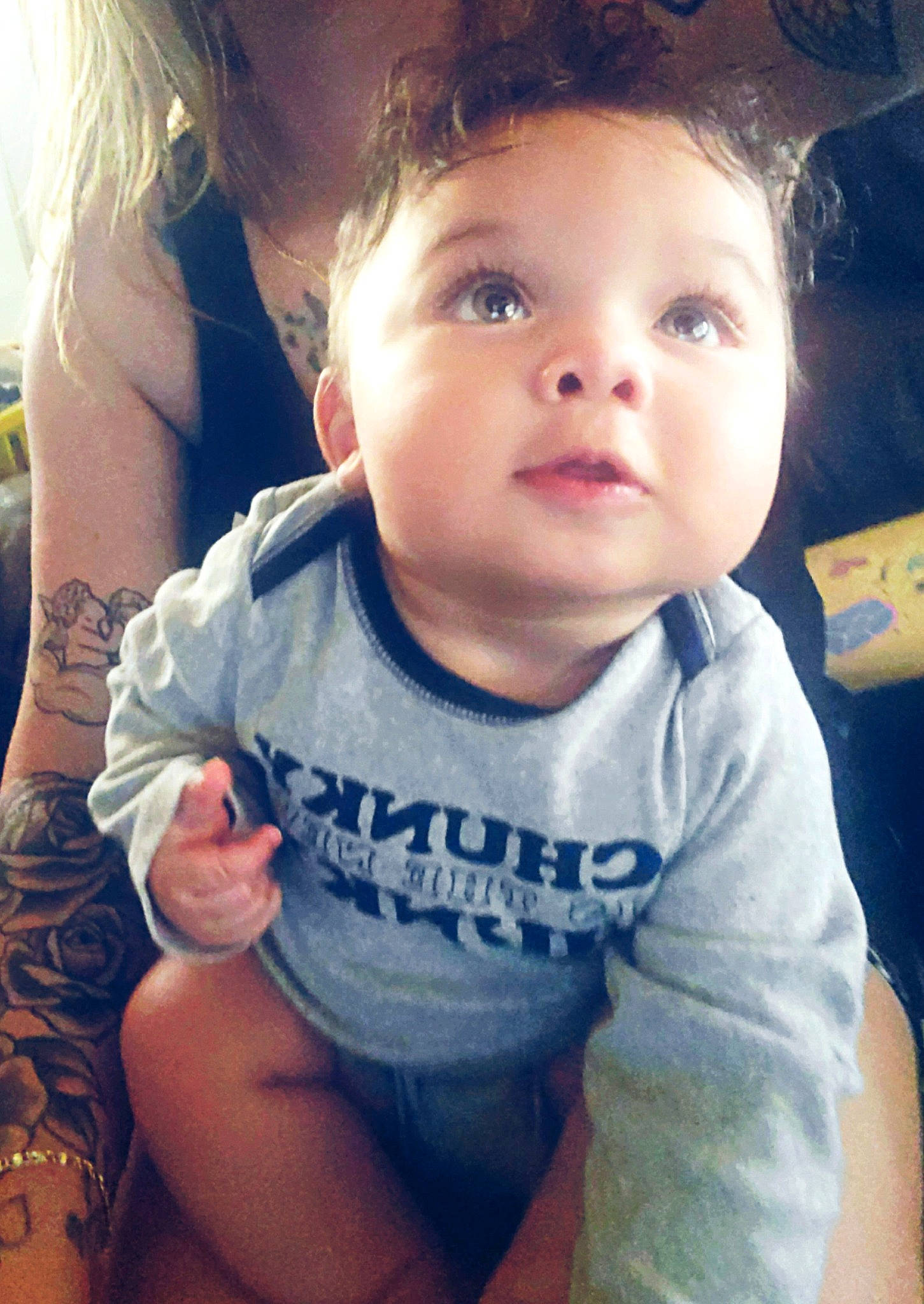 Julian is registered to the contest to win money with this photo: baby_toddler_clothing, cloud, ear, eyebrow, eyelash, finger, gesture, hair, happy, human_body, iris, lip, mouth, muscle, neck, nose, organ, person, shoulder, skin