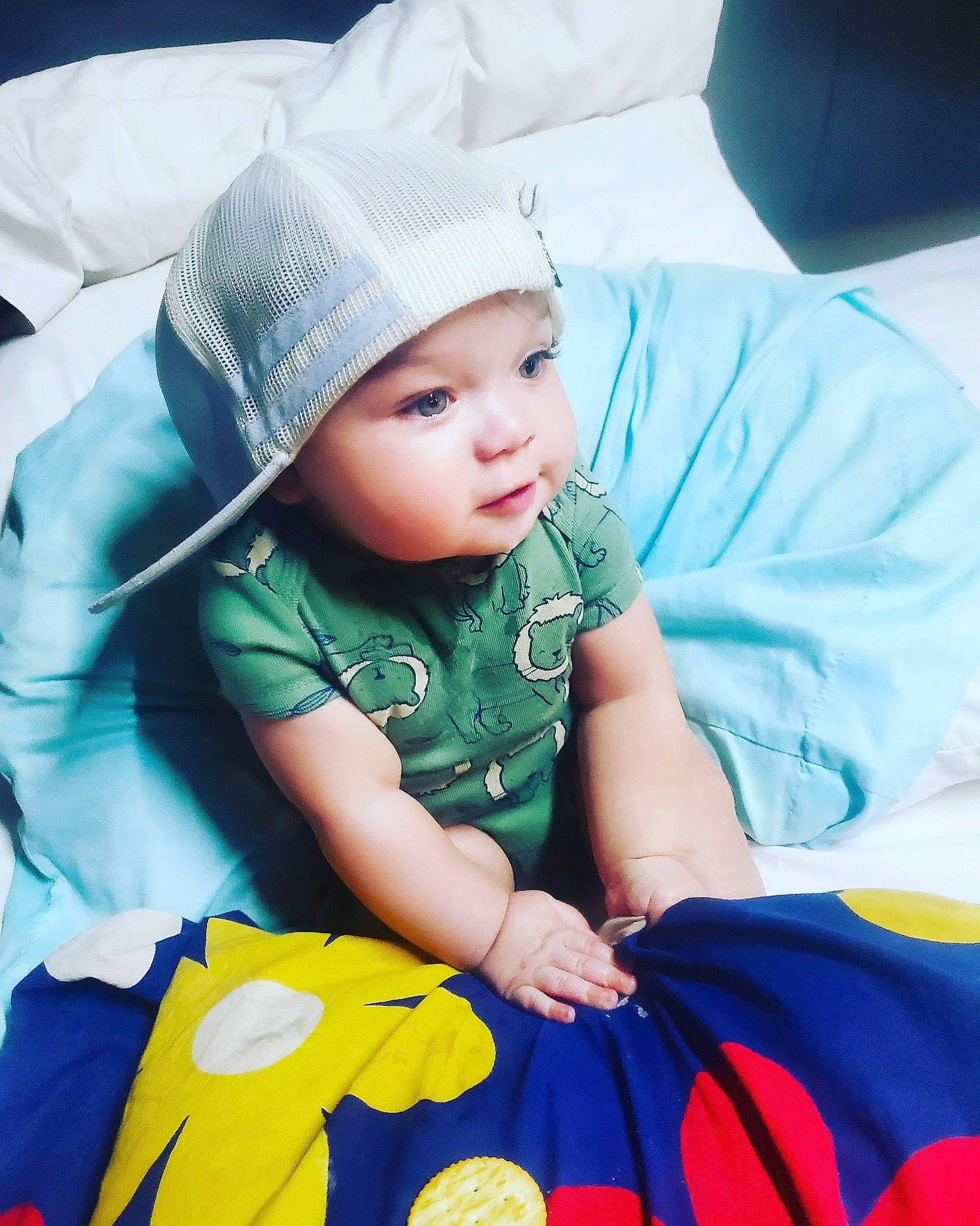 Julian is registered to the contest to win money with this photo: aqua, azure, baby, baby_toddler_clothing, cap, child, comfort, cool, face, flash_photography, happy, hat, headwear, pattern, person, product, skin, sleeve, textile, toddler