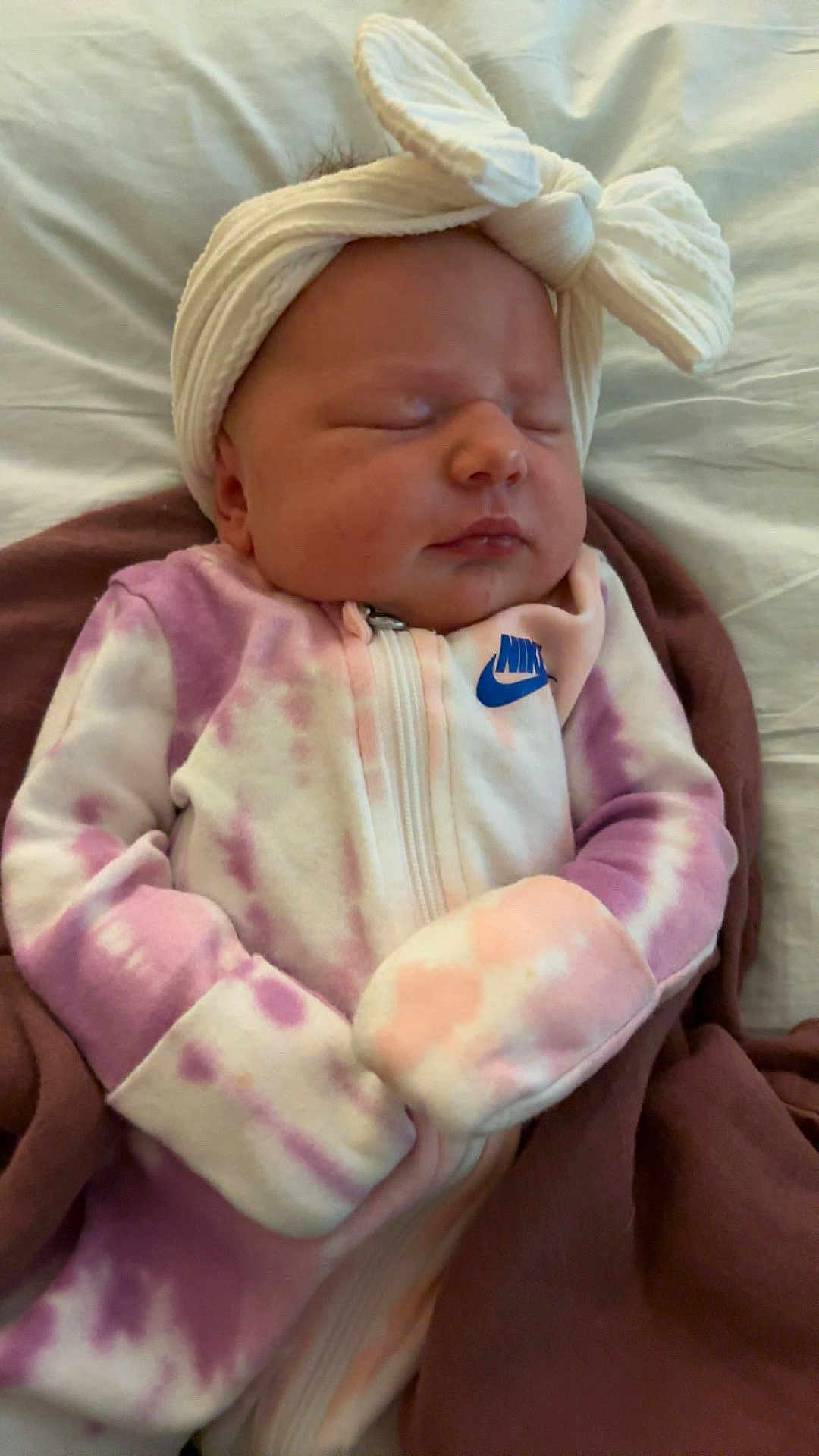 Serenity joined the competition — help win amazing prizes! baby, newborn, sleeping, headband, bow, onesie, tie_dye, clothing, infant, cute, soft, blanket, resting, peaceful, portrait, indoors, person, sleep, child, cute_outfit