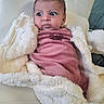 baby, blanket, child, cozy, curious, cute, expression, face, fur_texture, indoor, infant, pink_clothing, portrait, seated, soft_texture, warm, white_chair, wide_eyes, wrapped, young
