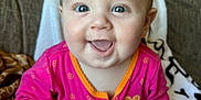 Ariellah joined the competition — help win amazing prizes! architecture, baby, babylaughing, bodypart, clothing, couch, cushion, face, furniture, happy, head, homedecor, indoors, laughing, mouth, pajamas, person, photography, portrait, smile