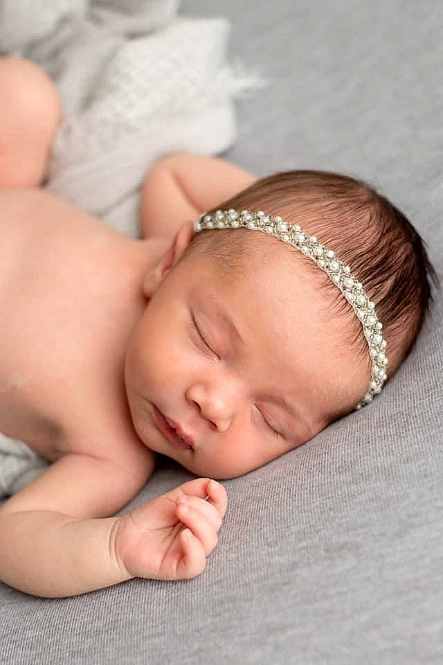 Avah Rae Lynn Caines is registered to the contest to win money with this photo: baby, baby_toddler_clothing, cheek, child, comfort, eyebrow, eyelash, fashion_accessory, finger, gesture, grass, happy, jewellery, nail, neck, pattern, person, skin, thumb, toddler