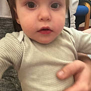 Levi joined the competition — help win amazing prizes! toddler, child, baby, face, hand, person, clothing, striped_shirt, indoor, curious, rosy_cheeks, young_child, close_up, holding, adult_hand, candid, blurry, portrait, skin, expression