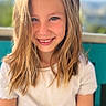 background_blur, blonde_hair, casual_clothing, child, childhood, cute, face, girl, happy, human, natural_light, nature, outdoor, person, portrait, smile, summer, sunlight, white_tshirt, young