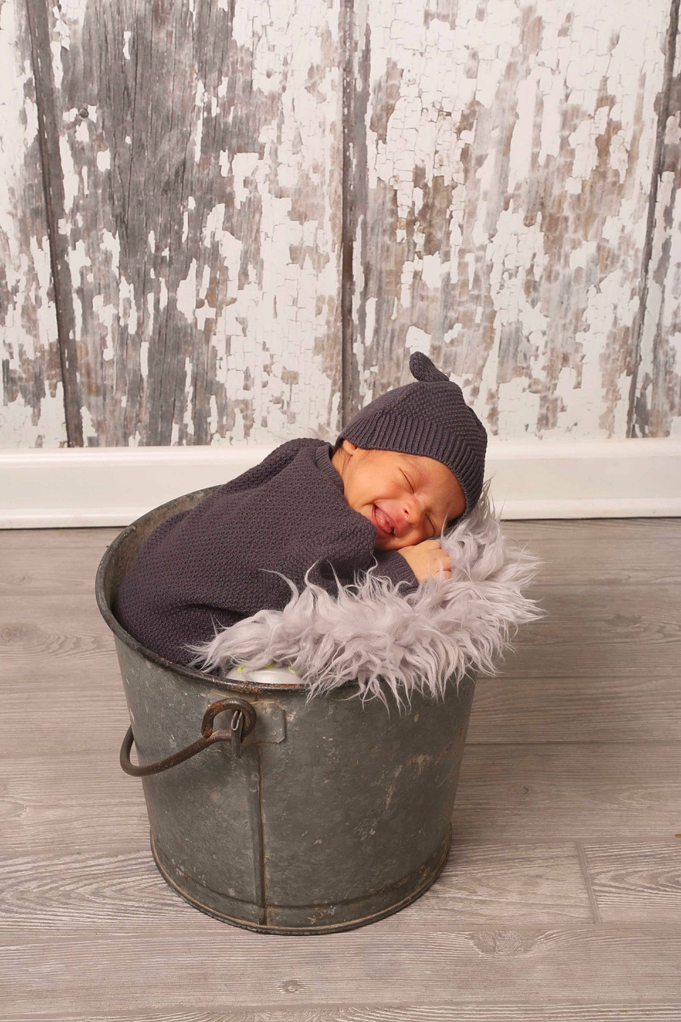 Dawson is registered to the contest to win money with this photo: art, beanie, cap, child, freezing, fun, fur, hat, headwear, hood, jacket, person, playing_in_the_snow, portrait_photography, room, sitting, smile, snow, sunglasses, toddler