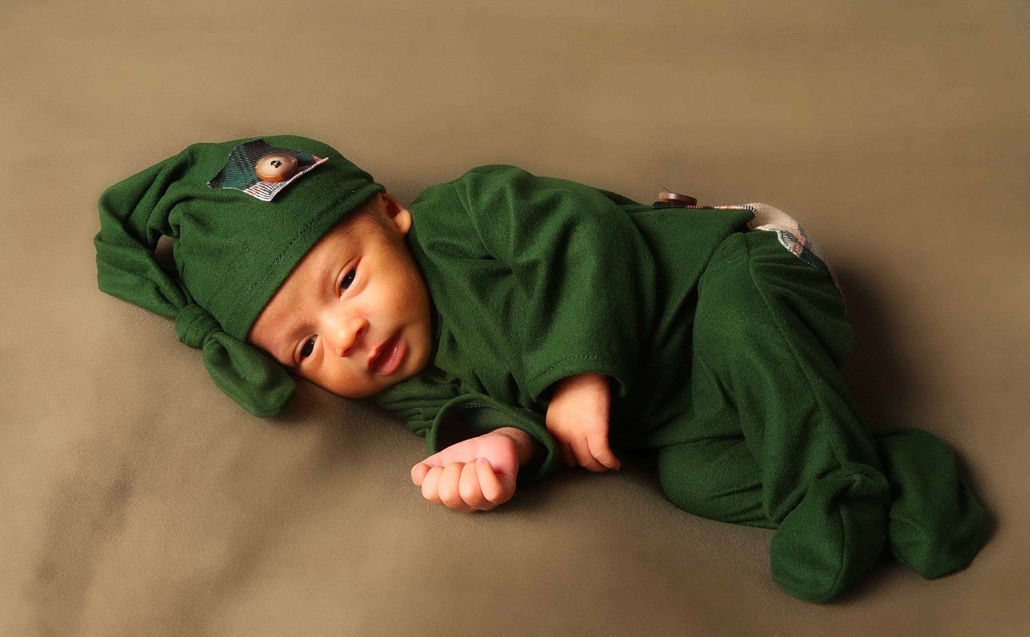 Dawson joined the competition — help win amazing prizes! baby, baby_toddler_clothing, beanie, cap, cheek, child, comfort, face, flash_photography, flooring, fun, grass, headwear, linens, person, polar_fleece, portrait_photography, room, sitting, sleeve