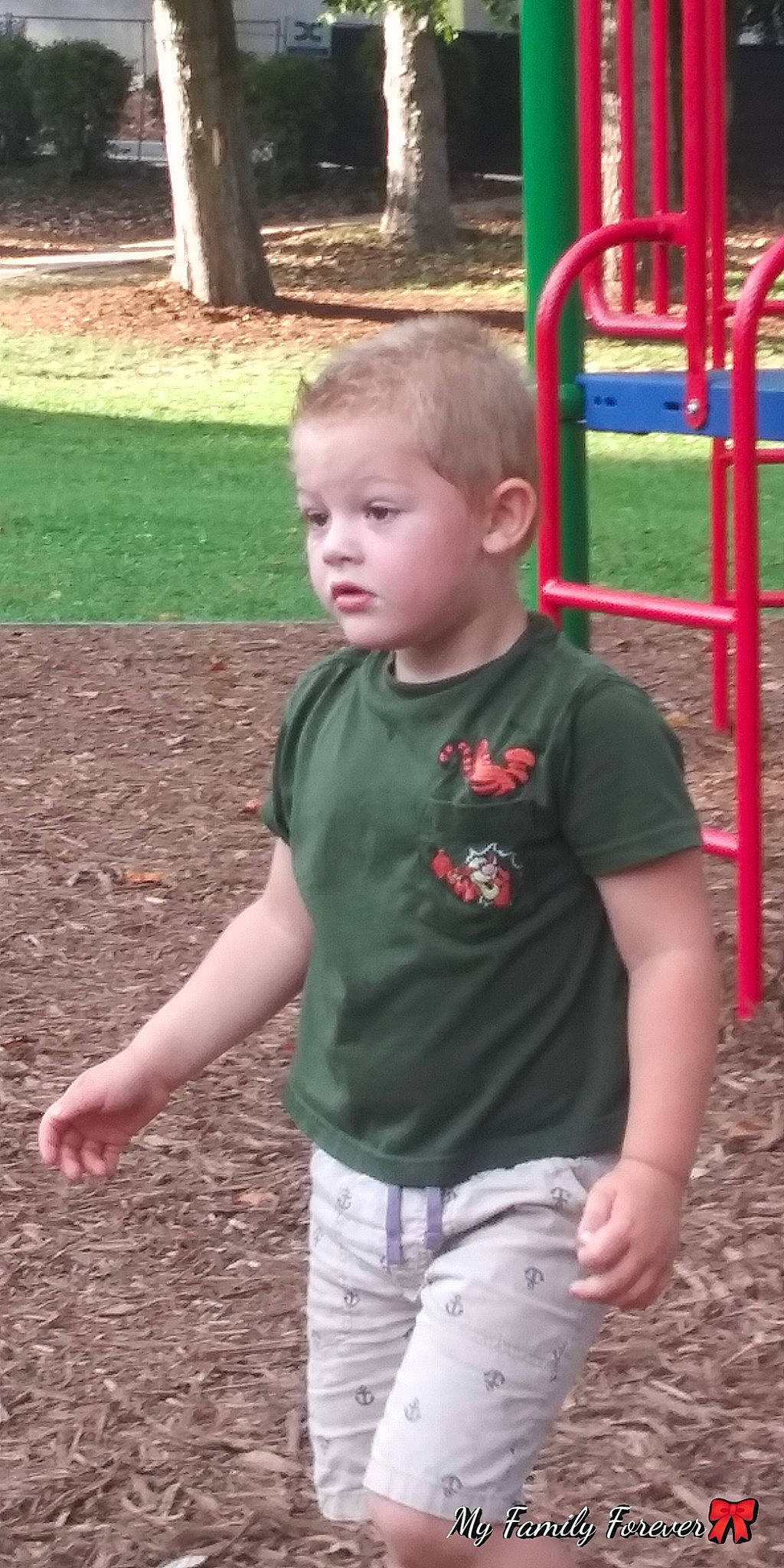 Kaylebe joined the competition — help win amazing prizes! child, city, fun, grass, human_settlement, male, outdoor_play_equipment, person, play, playground, public_space, recreation, sitting, smile, soil, t_shirt, toddler