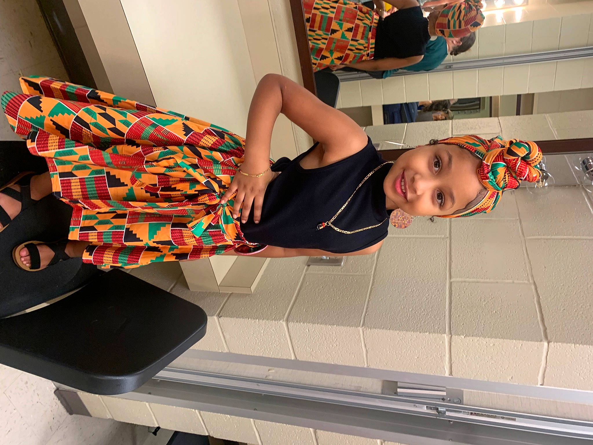 Jernie is registered to the contest to win money with this photo: automotive_design, comfort, elbow, flooring, fun, headwear, human_leg, joy, knee, magenta, pattern, person, room, shoulder, sitting, smile, snapshot, thigh, toddler, waist