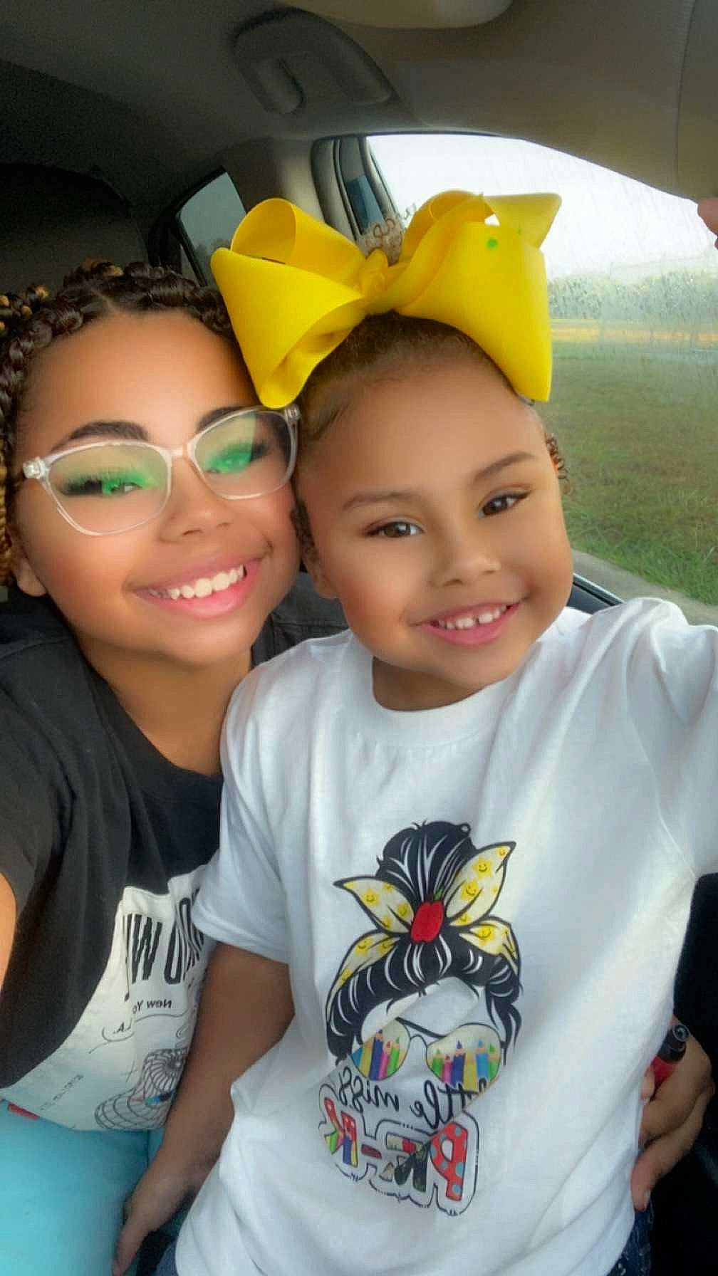 Jaizalynn is registered to the contest to win money with this photo: child, cool, face, facial_expression, friendship, fun, hairstyle, happy, joy, leisure, organ, people, person, product, skin, sleeve, smile, summer, t_shirt, white