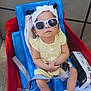 Amira joined the competition — help win amazing prizes! baby, child, sunglasses, headband, yellow_dress, seat, seatbelt, medical_equipment, cables, hospital, toddler, indoors, person, footwear, bandage, bracelet, blue, red, white, cute