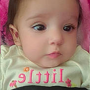 Angelica joined the competition — help win amazing prizes! baby, infant, face, eyes, hair, clothing, blanket, pink, black_cloth, close_up, portrait, cute, child, young, soft_skin, lying_down, indoors, expression, curious, calm